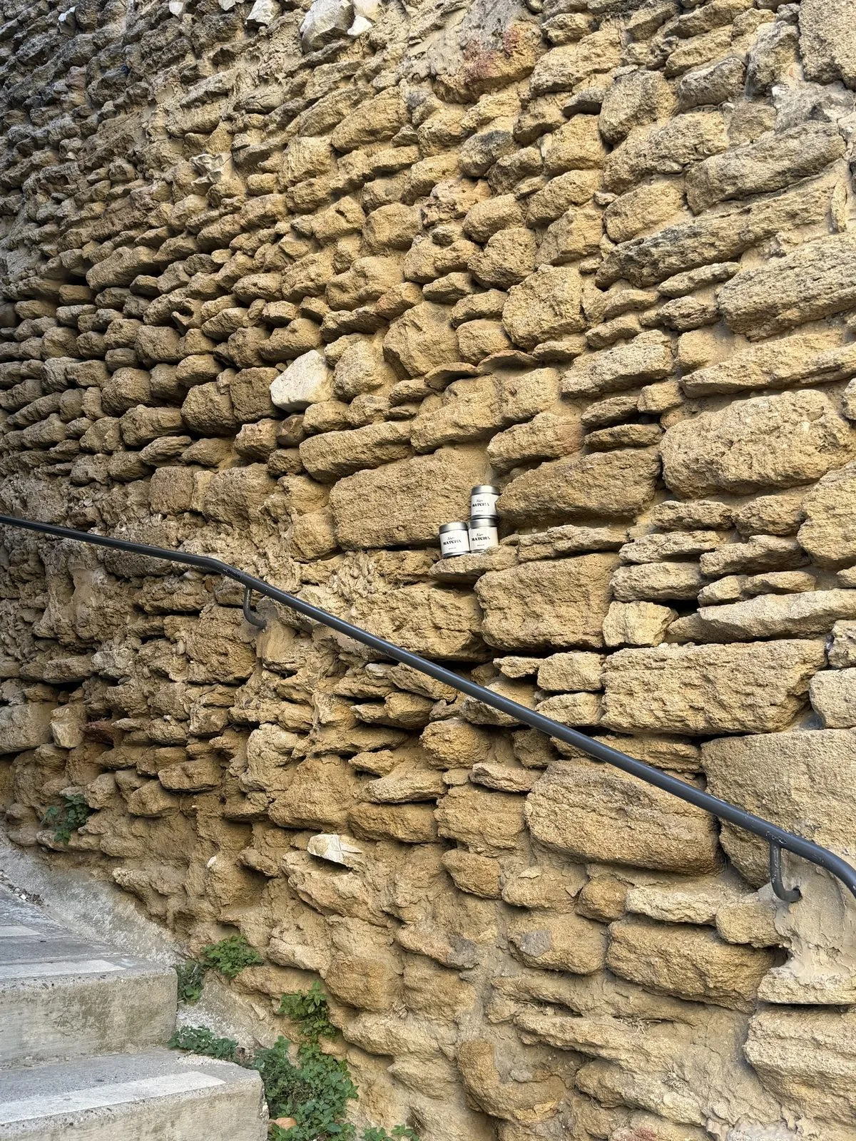 Stone stairs and Ramla Matcha tins